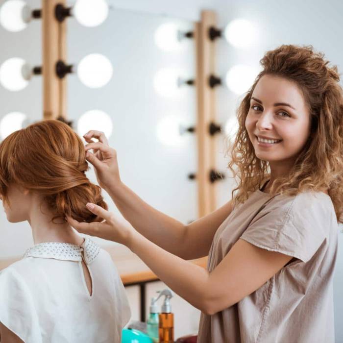 female-hairdresser-smiling-making-hairstyle-redhead-woman-beauty-salon female-hairdresser-smiling-making-hairstyle-redhead-woman-beauty-salon